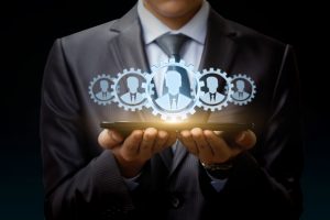 Businessman on tablet represents a team of Customers . Businessman on tablet represents a team of Customers on the virtual screen.